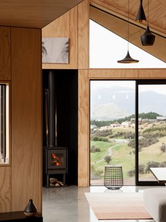 Extensive glazing keeps the interiors open and bright, while also enhancing the home's strong connection to its picturesque surroundings.
