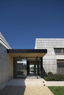 From the courtyard, views extend straight through the home to the other side of the structure. 