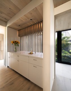A subdued material palette unifies the interiors and keeps them looking crisp and contemporary. 