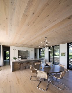 Oak floors and millwork throughout unify the spaces. 