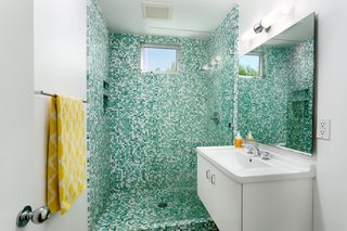 The master bath has a beautifully tiled walk-in shower. 