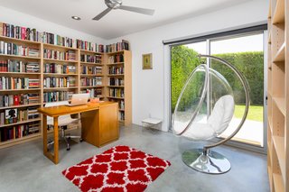 Polished concrete floors run throughout the entire home, linking all the rooms with the same sophisticated modern style.