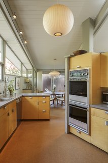 The updated kitchen maintains a midcentury feel. 