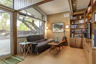 A nook off the living room provides a quiet spot for reading or watching television. 