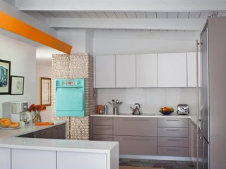 The updated kitchen maintains an authentic midcentury feel with the help of the original in-wall oven, which has been thoughtfully preserved.
