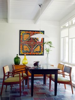 The dining area features slate tile flooring.