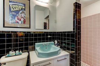 The bathrooms have original tiling that is still in pristine condition. 