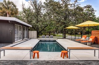 The outdoor pool deck has a brick hearth and is perfect for entertaining. 