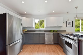 The kitchen has been conveniently modernized and features an open layout. 