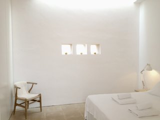 The minimalist interiors are predominantly white with an understated luxe vibe. 
