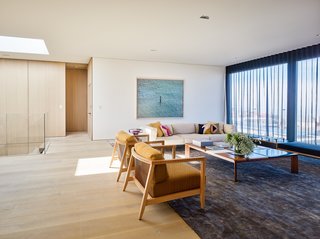 Thanks to the help of Nouel, the newly-expanded space now incorporates bright pops of color by way of paintings, furniture, and accessories.