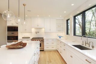 The transformed kitchen shows off how bright the home is now. 