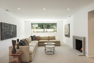 "I prefer to think of it as a lower level because it no longer has the feel of a basement," explains Silver. A large picture window lets in lots of natural light and frames an atrium filled with succulents. 