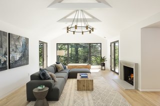 Silver opened up and vaulted the ceiling, which instantly created a bright and airy, modern interior. He also centered the picture window and added french doors that lead out to two separate outside patios. 
