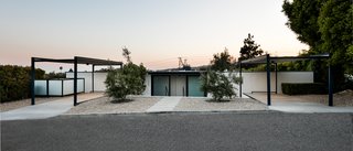 The 1,550-square-foot hillside home features a vertical T-shaped layout and houses dramatic city and ocean views.