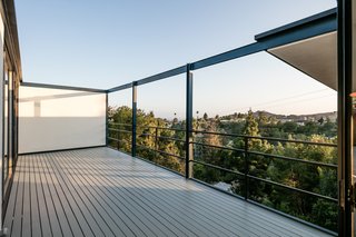 The property also has a 530-square-foot deck. Stairs from the deck lead to a children’s play area below.