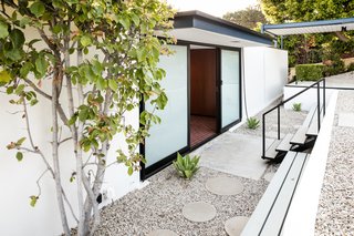 The structure is an updated showcase of midcentury modern architecture.