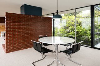 Here, you can see how the dining area and kitchen are behind the dividing wall. 