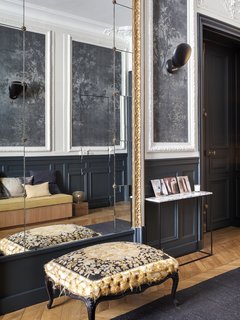 The entrance hall has been restored to its former glory with a bold choice of moody hues.