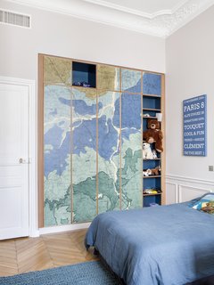 Oxford Clay by Rebel Walls has been placed on the wardrobe doors in one of the kids' rooms. 