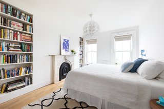 The spacious master bedroom has an original mantle, two built-in bookcases, and an enormous walk-in closet. 