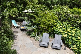 Steps lead from the deck to a lush garden. 