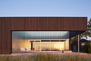 Materials such as sand, stone, and driftwood have been inspired by the lakefront site.