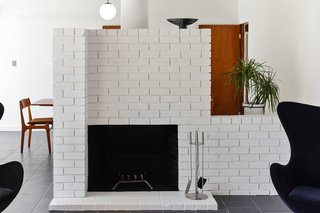 A detail of the original brick wood-burning fireplace. 