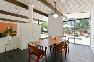 The dining area is on the backside of the fireplace and also overlooks the garden. 