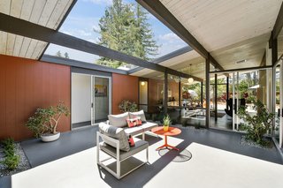 The atrium filters natural light into the rest of the abode. 