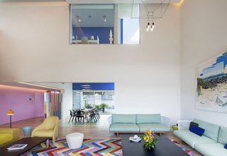 The large pendant lamp was designed by Arik Levy for Vibia, and the TamTam floor lamp was designed by Fabien Dumas for Marset. 