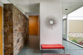 A hallway connects the public and private areas of the home. 