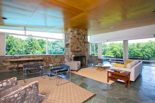 The original stone fireplace still serves as the focal point in the living room. 