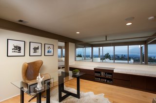 An open office space sits adjacent to the master suite. 