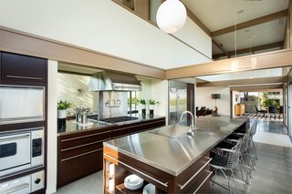 Sleek and stylish, the stainless steel chef's kitchen boasts numerous appliances from Viking.
