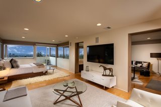 The master suite is on the upper level and features a sitting area and office space. 