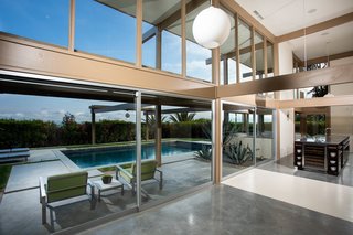 The kitchen also comes with a lovely view of the pool, seamlessly integrating the interiors with the exteriors. 