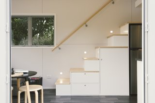 Despite its small size, the home features a surprising amount of storage space throughout, including the staircase that leads up to the bedroom.