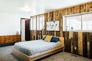 A wood-paneled guest room.