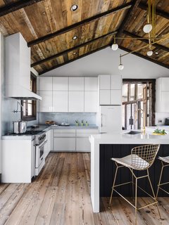 The kitchen was updated with high-end finishes and a sleek, contemporary style. 