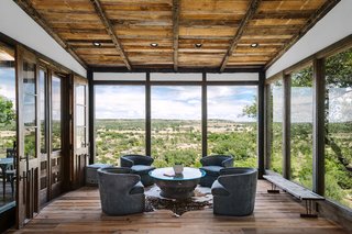 Extensive glazing provides ample natural light and panoramic views of the surrounding scenery. 