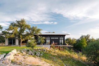 The main house was given a contemporary look with a metal roof and a black exterior. 