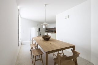 Meals can be taken al fresco or in the dining room. Locally sourced ceramics and wood pieces are artistic touches found throughout the home. 