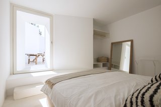 The elegant bedrooms feature large pendulum doors that also act as windows.