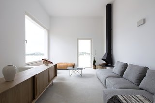 The cool midcentury fireplace was designed in 1965 by Spanish architects Alfonso Mila and Federico Correa.