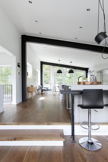 White interiors and ample glazing now make the space feel open and bright up. Blackened beams pick up on the industrial aesthetic of the exterior.