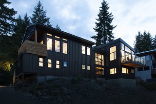 The exteriors of the two structures, the updated cabin, and the "modern box" addition were tied together with a standing seam metal facade. This helped give the connected complex a contemporary, industrial-inspired vibe.