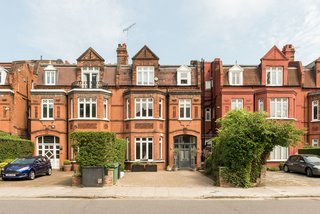 The traditional facade does little to hint at the apartment's interior modern aesthetic. 
