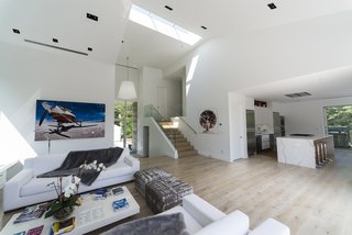 The glass entryway of the home opens straight into the living room. 