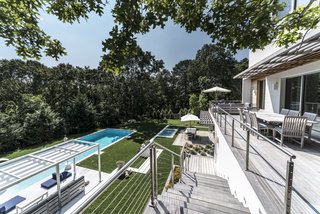 The backyard was terraced and the pool was redesigned. It went from a 14'x36' standard pool to a 18'x50' saltwater gunite structure with a hot tub terraced above it.